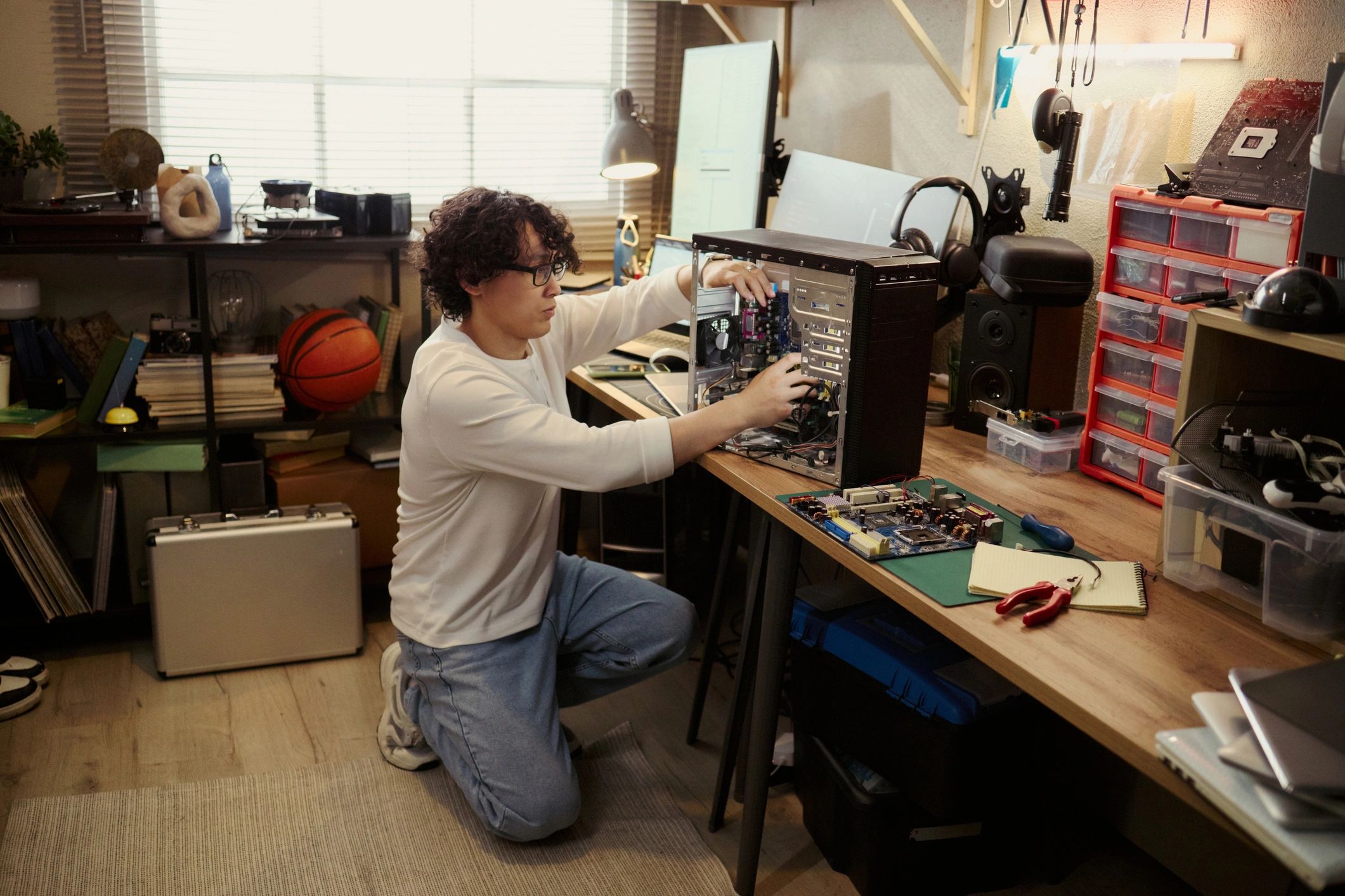 Computer hardware being examined at a workbench